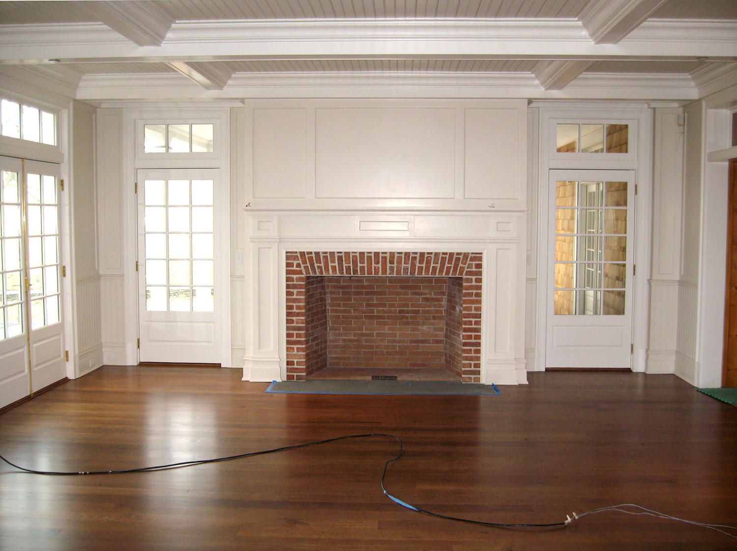 Panel and coffered ceiling set off this fireplace. Hillsdale, NY.