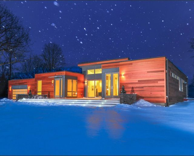Custom modern house during a snow storm. Copake, NY.
